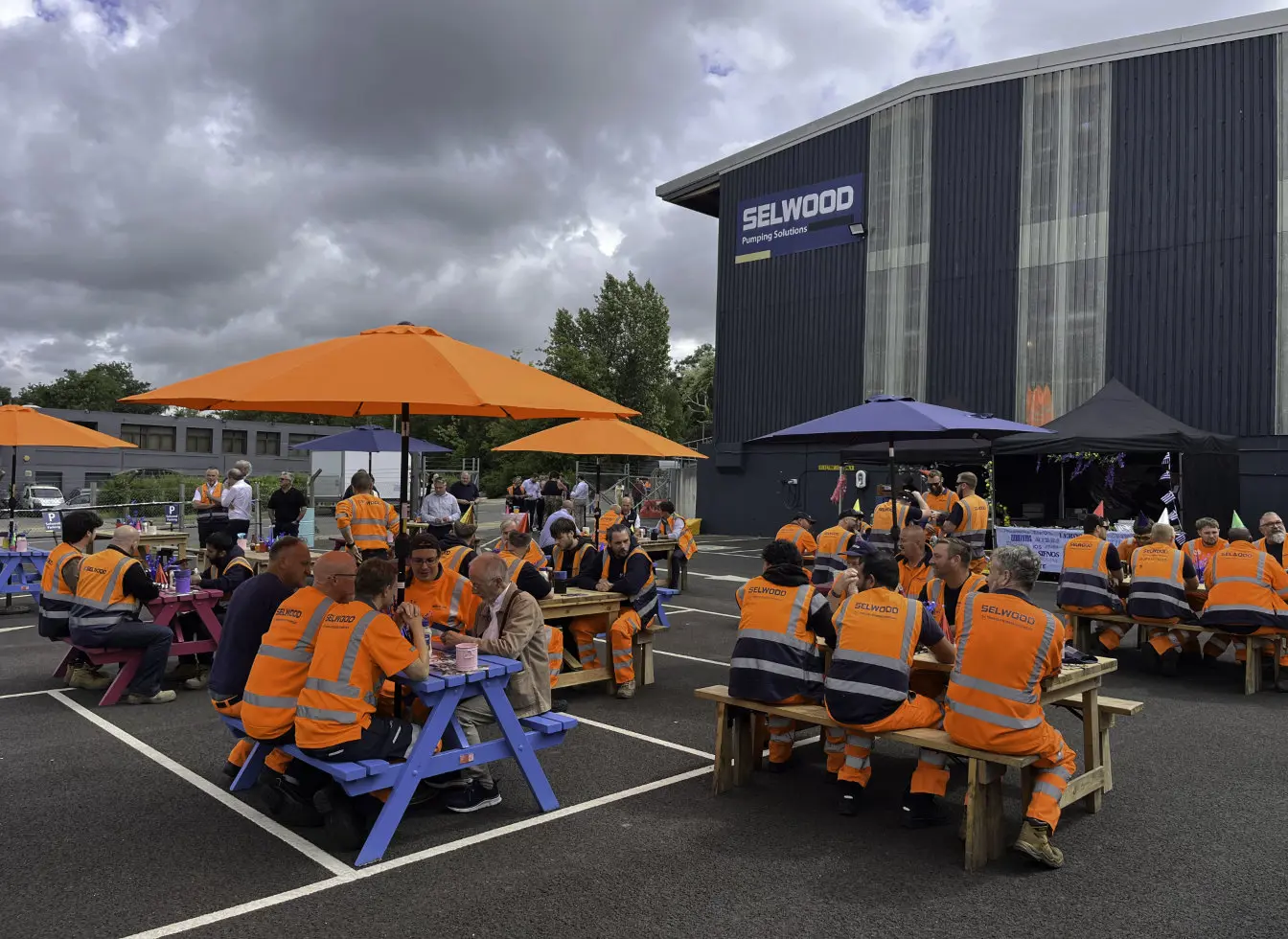 Selwood employees at the Chandlers Ford depot sit down for a barbecue celebrating the 80th anniversary of the company 