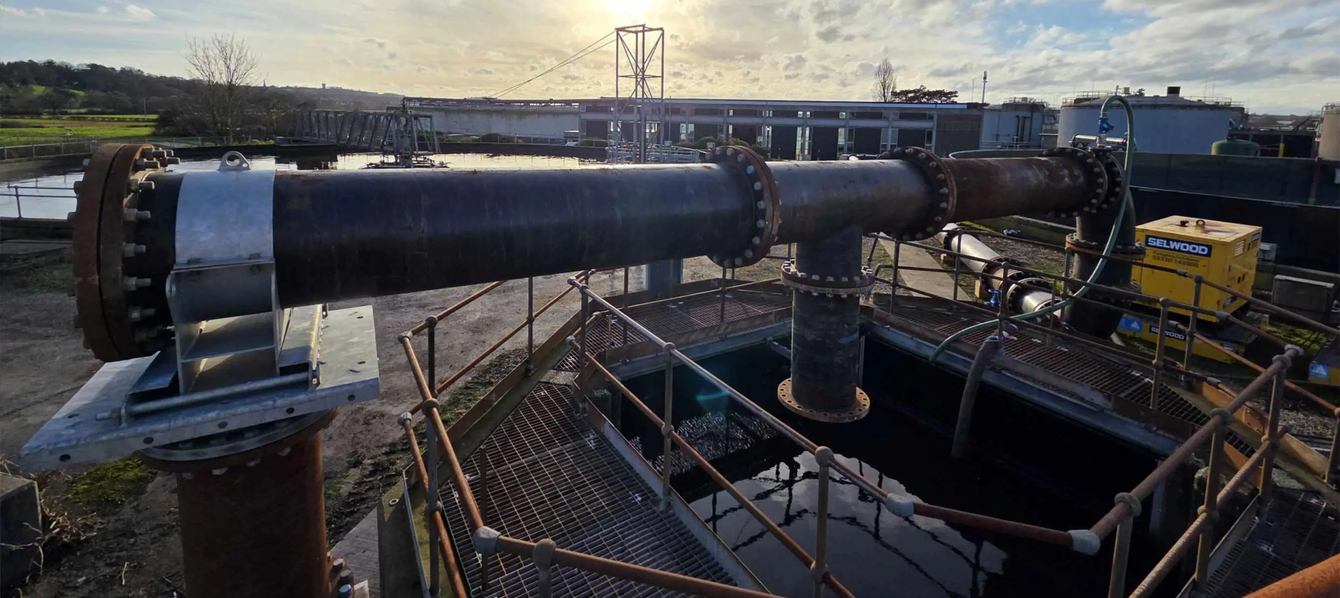 A Selwood pump on hire from the Birmingham depot at a wastewater treatment works with large pipework