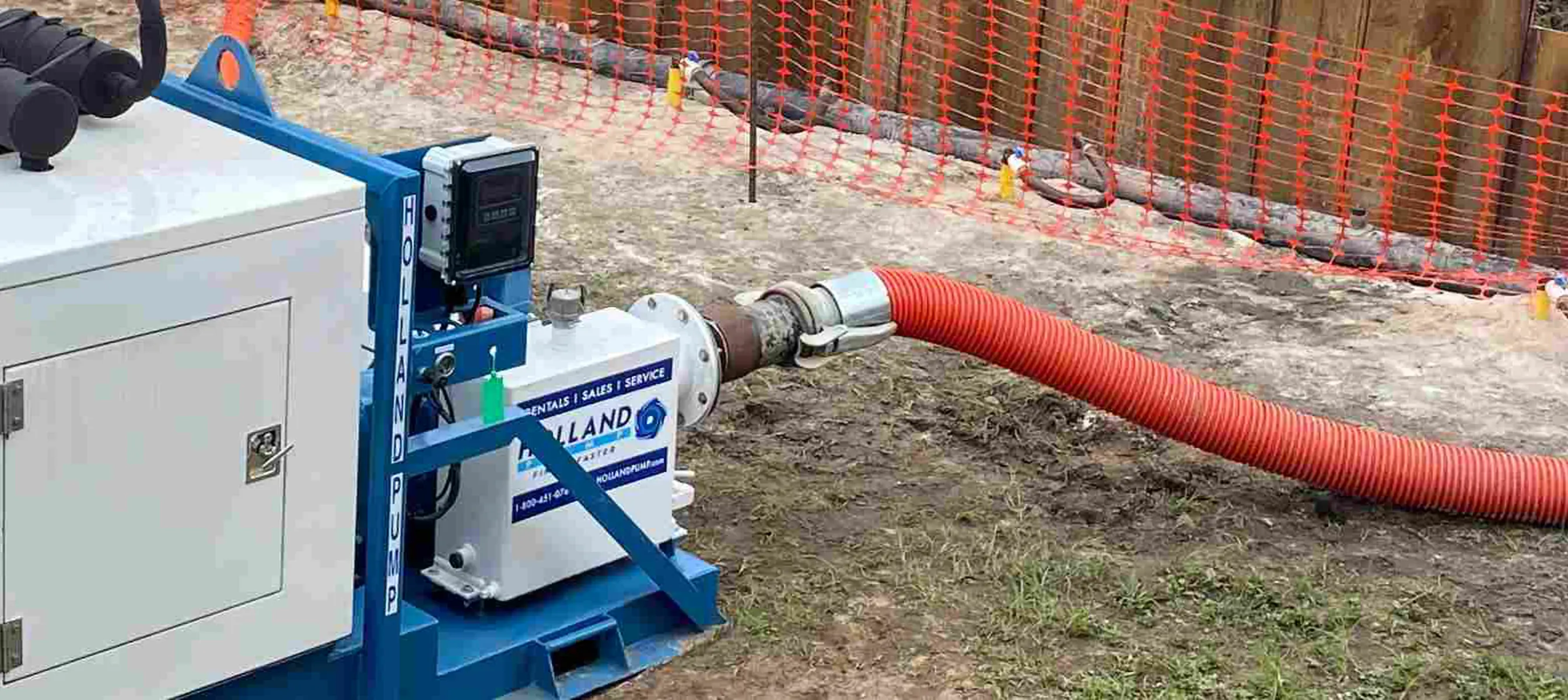 Engine-enclosed wellpoint pump connected to a wellpoint system, drawing down the water for sewer pipe connection