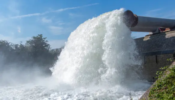 A pipe with water flowing out of it at a Vanderkamp project