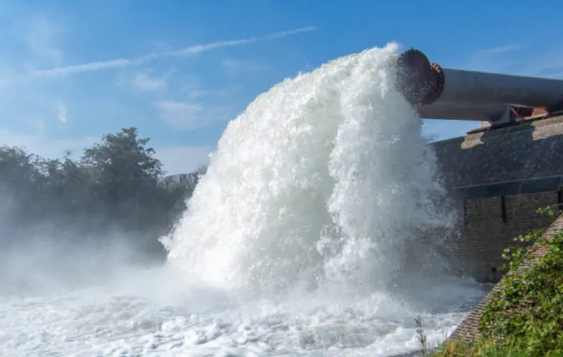 A pipe with water flowing out of it at a Vanderkamp project