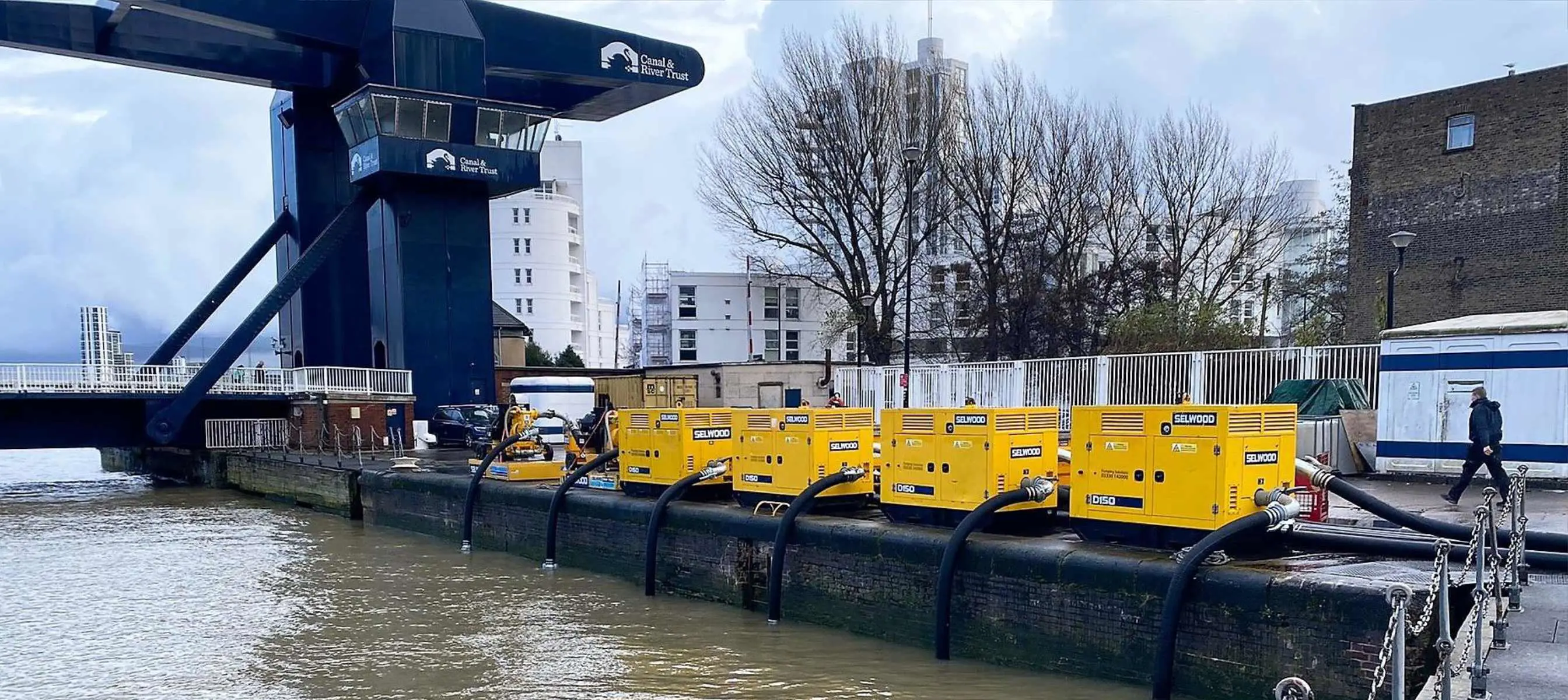 Selwood pumps on hire lined up along the River Thames in London